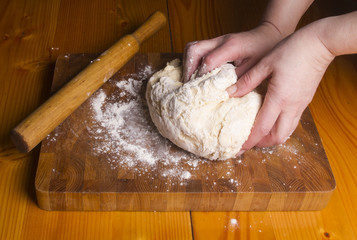 Making dough by female hands