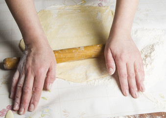 Making dough by female hands