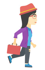 Business woman walking with briefcase.