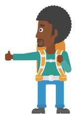 Young man hitchhiking.