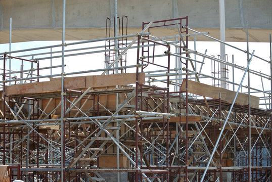 Scaffolding used to support a platform or form work as the temporary structure at the construction site for construction workers to work. 
