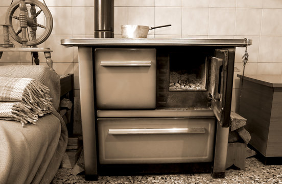 old wood-burning stove in the kitchen of ancient home