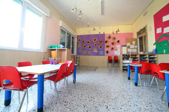 kindergarten classroom with drawings on the walls