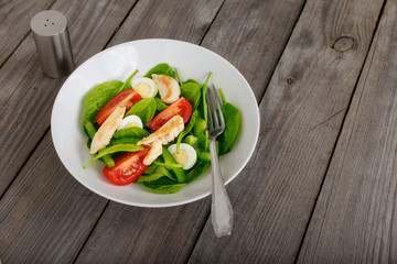 Fresh salad with spinach leaves