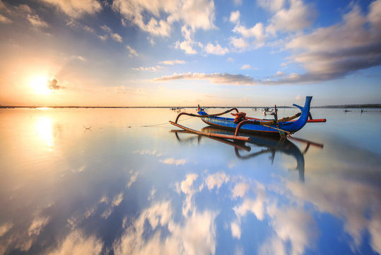 Morning Sun In Bali, Indonesia. Traditional Fishing Boats At Sanur Beach