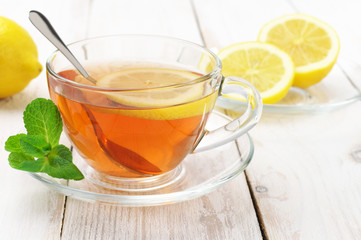 Tea in glass cup with lemon