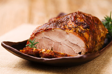 Roast pork with herbs and vegetables.