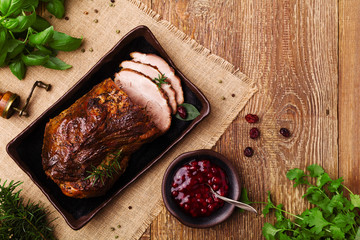 Roast pork with herbs and vegetables.