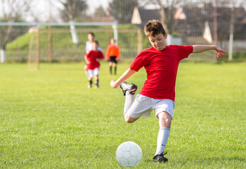  Boys kicking ball