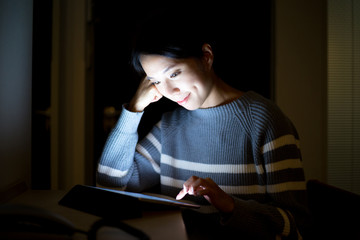 Woman use of tablet pc at home