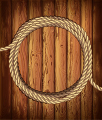 round frame of ropeson a wooden background.  . Marine good mood