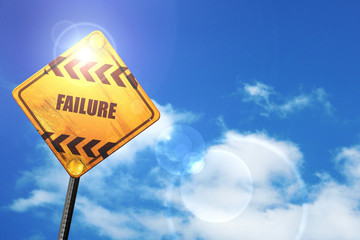 Yellow road sign with a blue sky and white clouds: Failure sign 