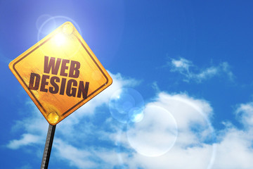 Yellow road sign with a blue sky and white clouds: web design