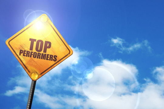 Yellow Road Sign With A Blue Sky And White Clouds: Top Performer