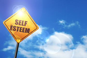 Yellow road sign with a blue sky and white clouds: self esteem