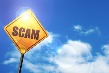 Yellow road sign with a blue sky and white clouds: scam
