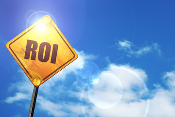 Yellow road sign with a blue sky and white clouds: roi