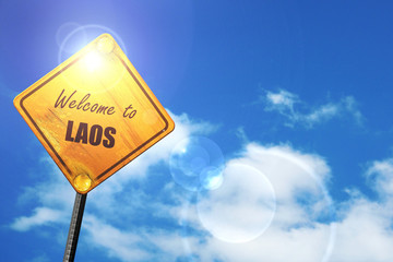 Yellow road sign with a blue sky and white clouds: Welcome to la