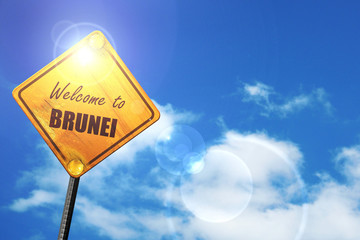 Yellow road sign with a blue sky and white clouds: Welcome to br