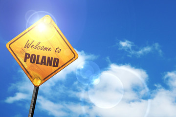 Yellow road sign with a blue sky and white clouds: Welcome to po