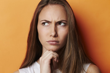 Frowning and thoughtful model in studio