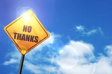 Yellow road sign with a blue sky and white clouds: no thanks sig