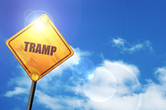 Yellow road sign with a blue sky and white clouds: tramp sign ba