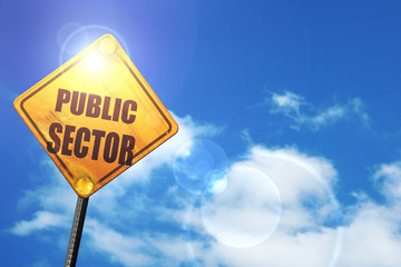 Yellow road sign with a blue sky and white clouds: public sector
