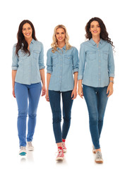 Fototapeta premium 3 happy casual women walking forward and smile
