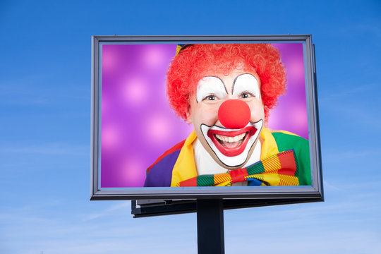 Clown auf Werbetafel