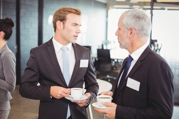 Businesspeople having a discussion during break time