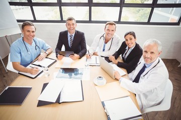 Portrait of happy medical team in conference room