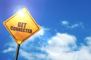 Yellow road sign with a blue sky and white clouds: get connected