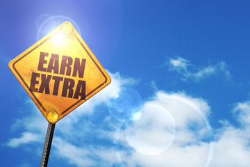 Yellow road sign with a blue sky and white clouds: earn extra