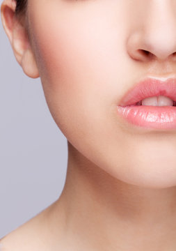 Half face female beauty portrait withrose color lips