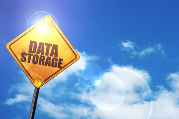 Yellow road sign with a blue sky and white clouds: data storage