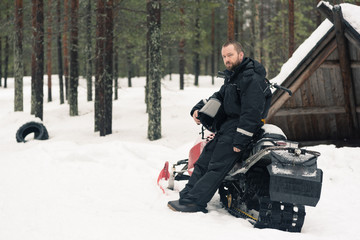 Man with a snowmobile