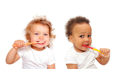 Black and white baby toddlers brushing teeth