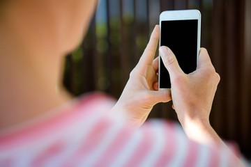 female hands typing on a smartphone