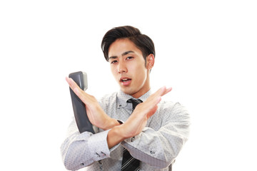 禁止の意思表示をする男性