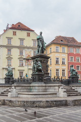 Fototapeta premium Graz, Austria - February 28, 2016. Fountain and memorial to the archduke Johann, on Hauptplatz Square.