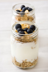Yogurt with fresh blueberries and cereals

