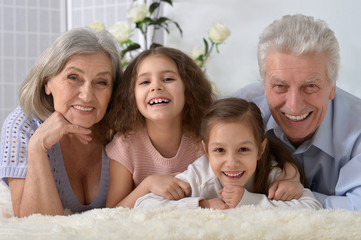 Happy senior couple with grandchildren