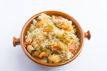 High-key image of white plate with quinoa lentil salad and bowl
