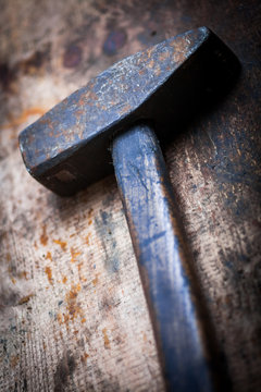 Hammer on wooden plank