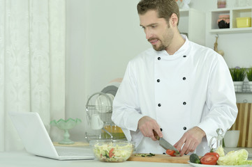 Fototapeta na wymiar Man cooking in kitchen