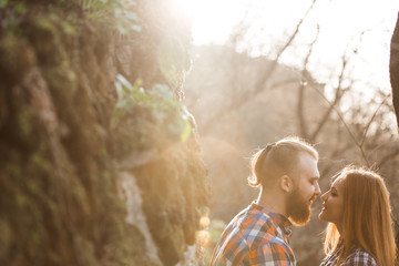 Loving couple, sunset,red-haired people, mountains,a man with a beard