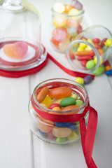 Multicolor candies in glass jars