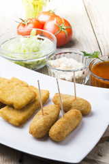 croquettes balls and different kind of sauces on a plate on a cl