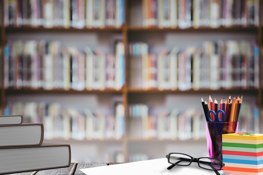 Composite image of school supplies on desk